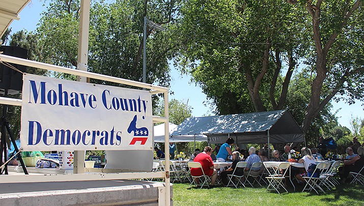 Community members attend the 25th annual Mohave County Democrats Central Committee picnic in Metcalfe Park in Kingman on Saturday, May 14. Attendees ate, mingled, heard from candidates, and asked them questions. (Photo by MacKenzie Dexter/Kingman Miner)