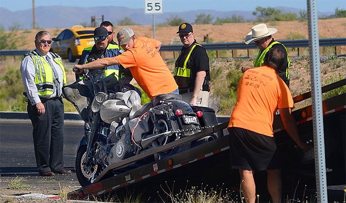 A Harley Davidson is removed from State Route 260 after a crash that seriously injured a Chino Valley man. (The Verde Independent/Vyto Starinskas)