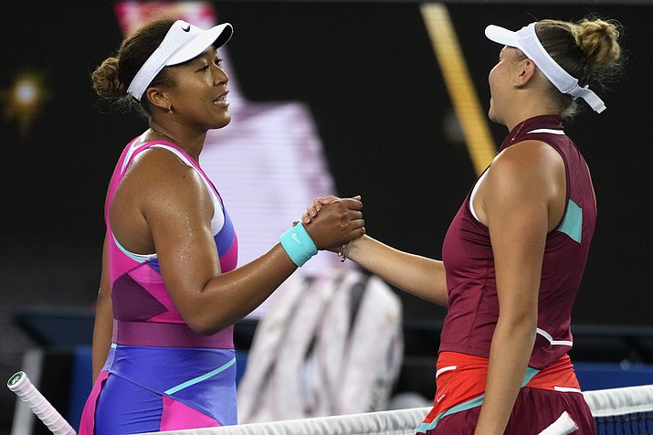 Naomi Osaka, left, of Japan, congratulates Amanda Anisimova of the U.S. after their third round match at the Australian Open tennis championships in Melbourne, Australia, Friday, Jan. 21, 2022. Naomi Osaka’s return to the French Open will be a tough test against the player who beat her at the Australian Open, No. 27 Amanda Anisimova. (Simon Baker/AP, File)