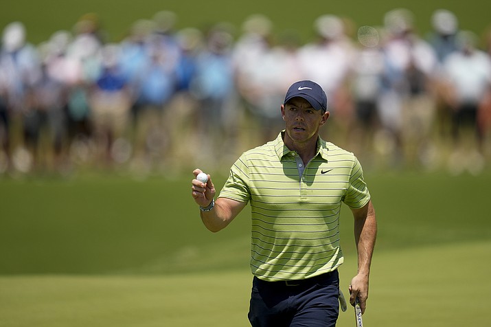 Rory McIlroy, of North Ireland, waves after making a putt on the first hole during the first round of the PGA Championship tournament, Thursday, May 19, 2022, in Tulsa, Okla. (Sue Ogrocki/AP)