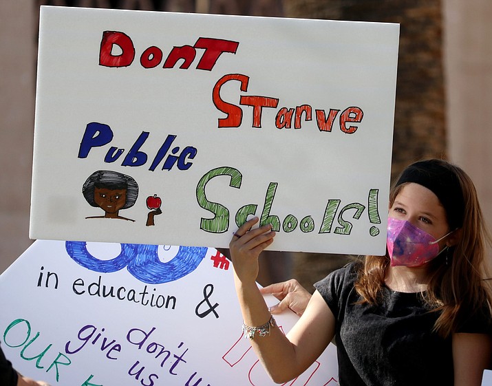 Education advocates said they were not surprised by a new Census Bureau report that showed Arizona was one of the worst states in the nation for per pupil education spending 2020, calling the state’s schools historically underfunded. Here, Alivia Davis, 11, rallies for education at the state Capitol in February. (Hope O’Brien/Cronkite News, File)