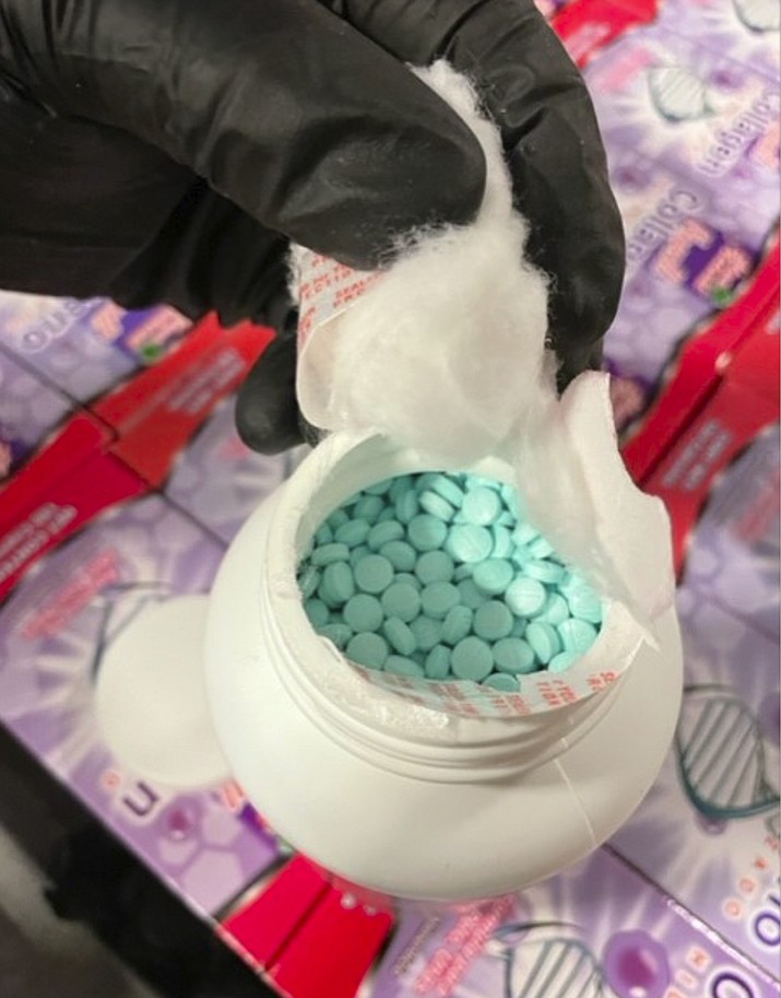 This photo released by the Casa Grande Police Department, shows a collagen supplement bottle that concealed approximately 500,000 fentanyl pills that were found in an SUV pulled over for speeding on Interstate 10 in Pinal County, Arix., on Monday May 23, 2022. Two women, Martha Lopez, 31, and Tania Luna Solis, 30, were arrested Monday after about 500,000 fentanyl pills were found collagen supplement bottles in an SUV pulled over for speeding on Interstate 10 in Arizona, police said.(Casa Grande Police Department via AP)