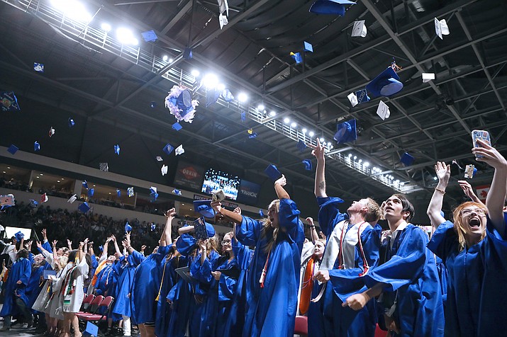 Chino Valley High School Class of 2022 graduates toss their uniquely decorated mortarboards into the air upon becoming official graduates. (Matt Santos/Courtesy)