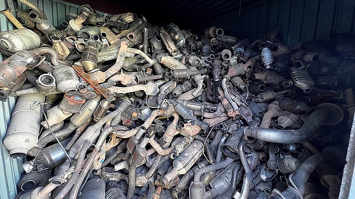 This photo provided by the Phoenix Police Department shows stolen catalytic converters that were recovered after detectives served a search warrant at a storage unit in Phoenix on Thursday, May 27, 2022. The bust came amid a national surge in thefts of the pricy auto parts that play a critical in reducing vehicle emissions and has led lawmakers in 36 states and in Washington D.C. to consider new laws to address the problem. (Phoenix Police Department via AP)