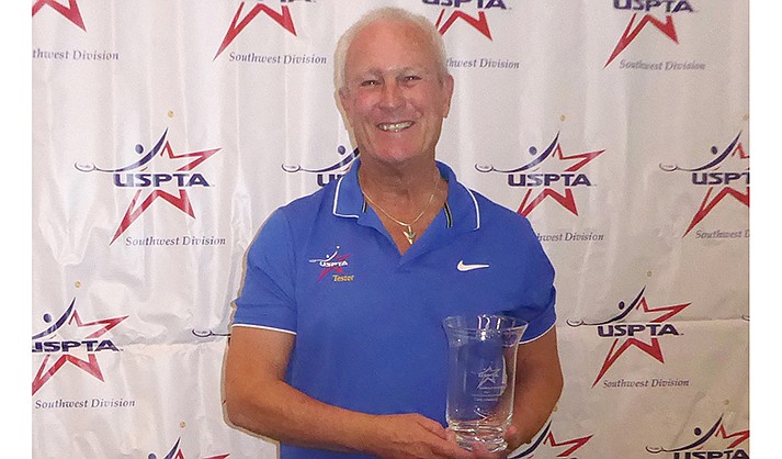 Larry Lineberry receives the George Basco Lifetime Achievement award from the Southwest Professional Tennis Association.