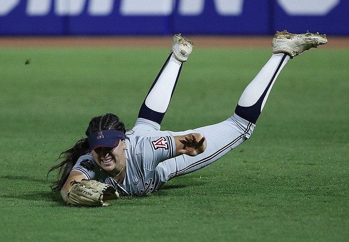 Arizona outfielder Paige Dimler (22) makes a diving catch for an out against Oregon State during the third inning of an NCAA softball Women's College World Series game Friday, June 3, 2022, in Oklahoma City. (Alonzo Adams/AP)