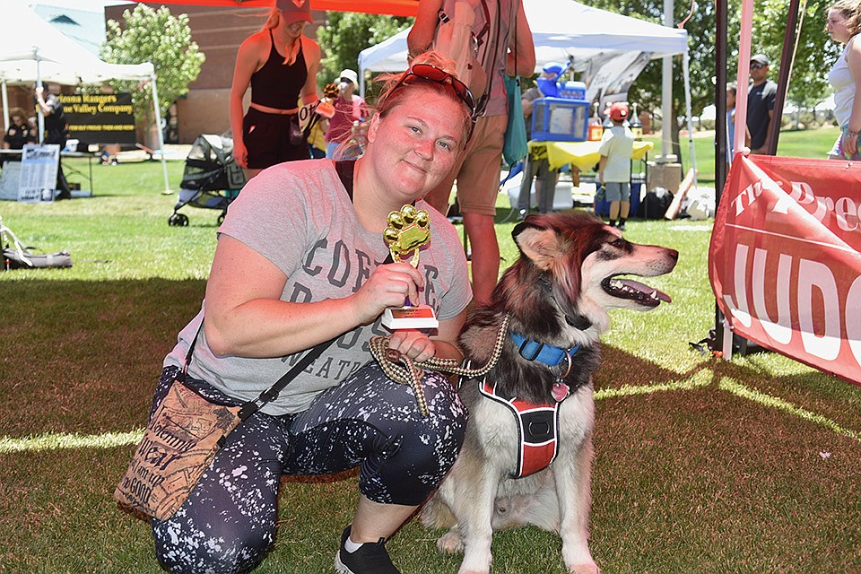 Second place winner of the Best Trick or Talent contest, Siku with owner Christina Branscum at WOOFstock at Prescott Valley Civic Center on Saturday, June 11, 2022. (Jesse Bertel/Courier)