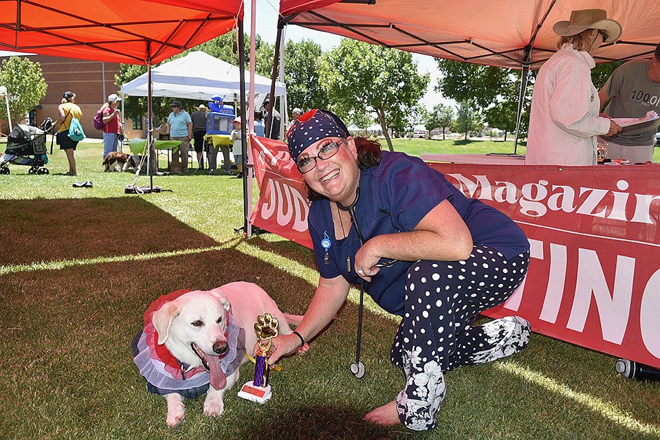 First place winner of the Best Trick or Talent contest, Gage with owner Gina Marie Presley at WOOFstock at Prescott Valley Civic Center on Saturday, June 11, 2022. (Jesse Bertel/Courier)