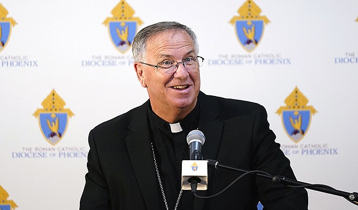 Bishop John Dolan speaks at a news conference after being named the new bishop for the Roman Catholic Diocese of Phoenix, Friday, June 10, 2022, in Phoenix. (AP Photo/Ross D. Franklin)