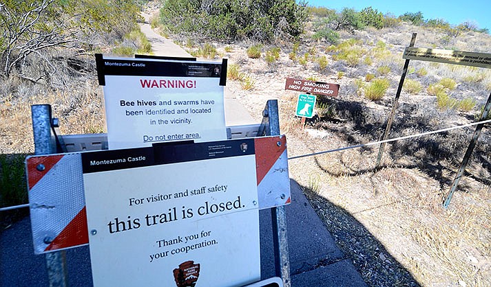 A sign closes the overlook and overlook trail at Montezuma Well on Monday June 6, 2022. (VVN/Vyto Starinskas)