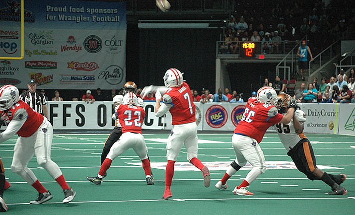 Wranglers QB Kaleb Barker (7) passes against the Rattlers at the Findlay Toyota Center in Prescott Valley, June 11, 2022. (Doug Cook/Courier)