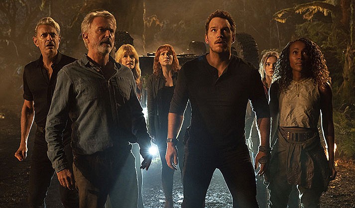 ‘Jurassic World: Dominion,’ a Universal Pictures release in theaters Thursday, is rated PG-13 by the Motion Picture Association of America for, “language, intense sequences of action, some violence.” Running time: 146 minutes. Two stars out of four. (AP Photo)