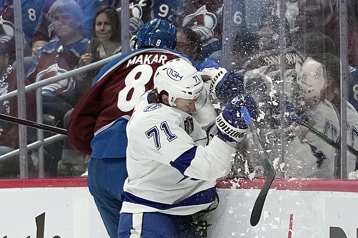 Tampa Bay Lightning center Anthony Cirelli (71) collides with Colorado Avalanche defenseman Cale Makar during the first period in Game 2 of the NHL hockey Stanley Cup Final, Saturday, June 18, 2022, in Denver. (John Locher/AP)