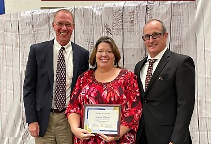 Jackie Plumb, Human Resources Department Personnel Coordinator, seen with HUSD Superintendent John Pothast, left, and Executive Director of Operations Kort Miner. (HUSD/Courtesy)