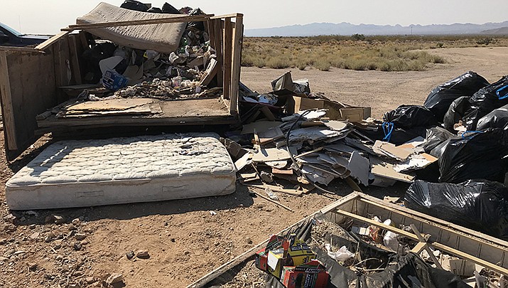 The Mohave County Board of Supervisors has stiffened the fines for illegal dumping in the county. A dump site near Chloride is pictured in this file photo. (Courtesy photo)
