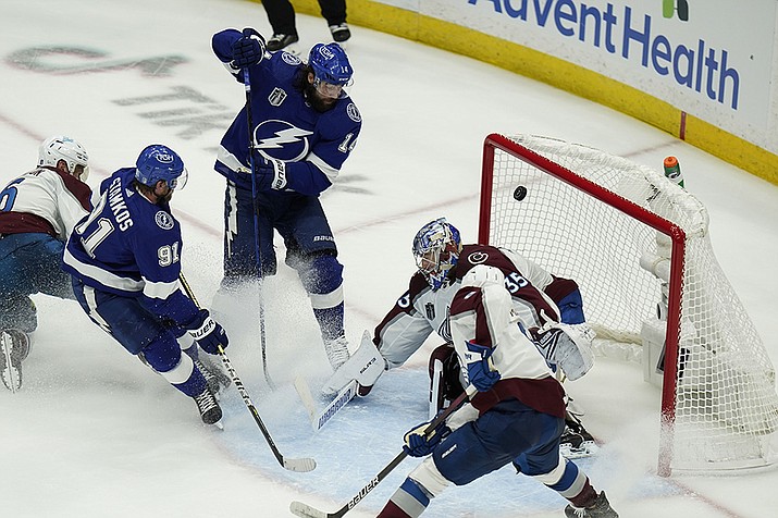 Tampa Bay Lightning left wing Pat Maroon (14) scores past Colorado Avalanche goaltender Darcy Kuemper (35) during the second period of Game 3 of the NHL hockey Stanley Cup Final on Monday, June 20, 2022, in Tampa, Fla. (Chris O'Meara/AP)