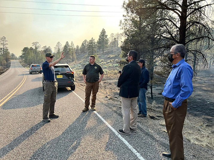 Navajo Nation President Jonathan Nez (center) listens as officials update him and others about the fires. (Photo/OPVP)