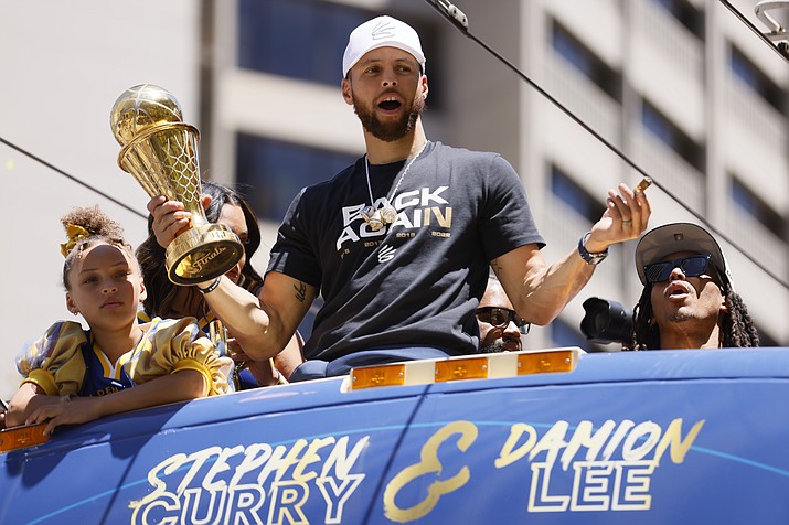 Stephen Curry and the Golden State Warriors celebrate at their NBA championship parade in San Francisco, Monday, June 20, 2022. (Santiago Mejia/San Francisco Chronicle via AP)