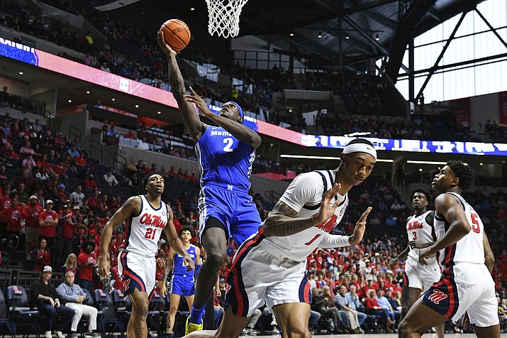 Memphis center Jalen Duren shoots over Mississippi guard Austin Crowley during the first half of an an NCAA game in Oxford, Miss., Saturday, Dec. 4, 2021. Duren is one of the top big men in the 2022 NBA draft. (Thomas Graning/AP, File)