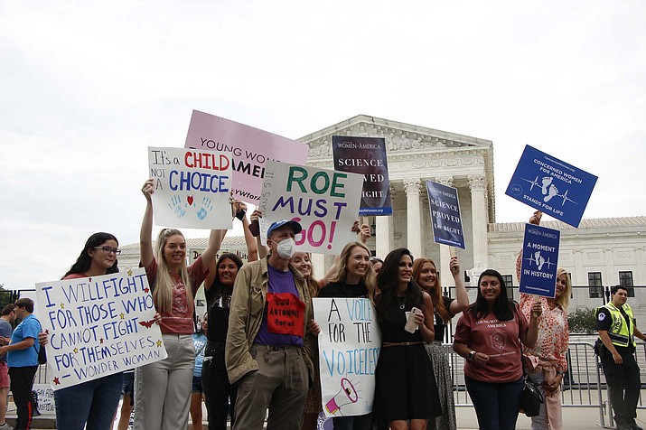With the Supreme Court expected to hand down a major abortion-rights ruling by the end of the month, protesters on both sides of the abortion debate have been showing up outside the court in recent weeks on days in which the justices were issuing opinions. (Neetish Basnet/Cronkite News)