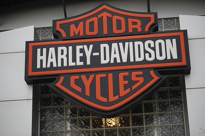 In this Sunday, Oct. 20, 2019 file photo, the company logo hangs over the entrance to a Harley Davidson dealership in Littleton, Colo. Federal regulators have accused Harley-Davidson and Westinghouse of imposing illegal warranty terms on customers and ordered them to fix their warranties and ensure that their dealers compete fairly with independent repair-makers. The Federal Trade Commission announced, Thursday, June 23, 2022, the action against the motorcycle maker and MWE Investments, which makes Westinghouse-brand outdoor power generators and related equipment. (David Zalubowski/AP, File)