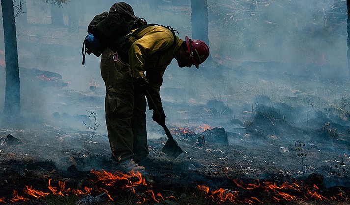 Andrew Hostad, Fire Prevention Supervisor on the Flagstaff Ranger District, working a fire in 2015. (Photo by Deborah Lee Soltesz/U.S. Forest Service)