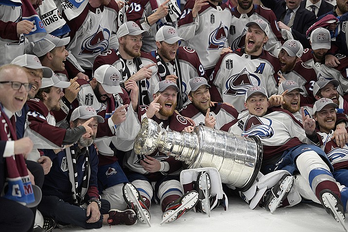 The Colorado Avalanche pose with the Stanley Cup after defeating the Tampa Bay Lightning 2-1 in Game 6 of the NHL hockey Stanley Cup Finals on Sunday, June 26, 2022, in Tampa, Fla. (Phelan Ebenhack/AP)