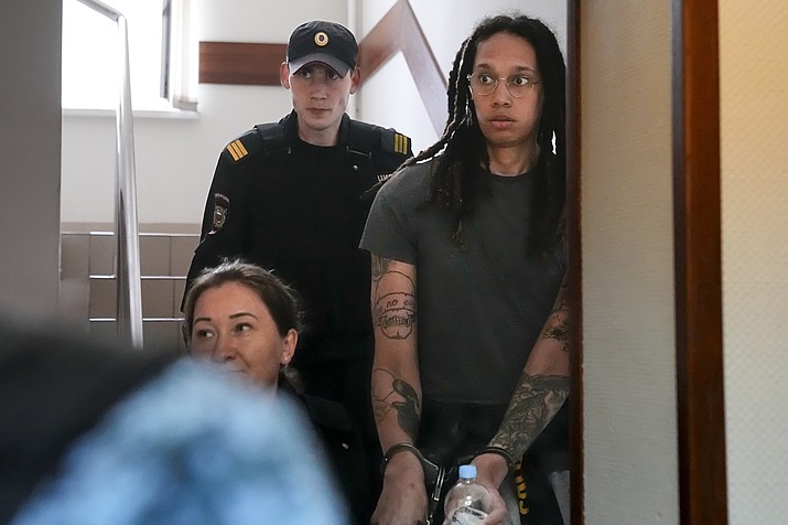 WNBA star and two-time Olympic gold medalist Brittney Griner is escorted to a courtroom for a hearing, in Khimki just outside Moscow, Russia, Monday, June 27, 2022. More than four months after she was arrested at a Moscow airport for cannabis possession, American basketball star Brittney Griner is to appear in court Monday for a preliminary hearing ahead of her trial. (Alexander Zemlianichenko/AP)