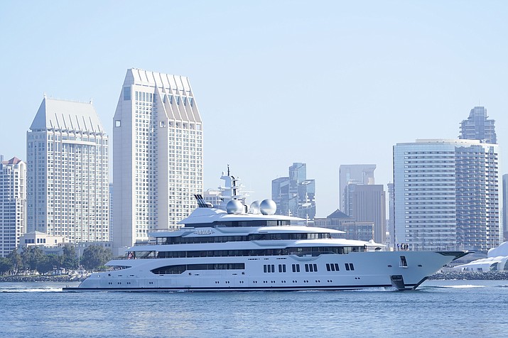 The super yacht Amadea passes San Diego as it comes into the San Diego Bay Monday, June 27, 2022, seen from Coronado, Calif. The $325 million superyacht seized by the United States from a sanctioned Russian oligarch arrived in San Diego Bay on Monday. (Gregory Bull/AP)