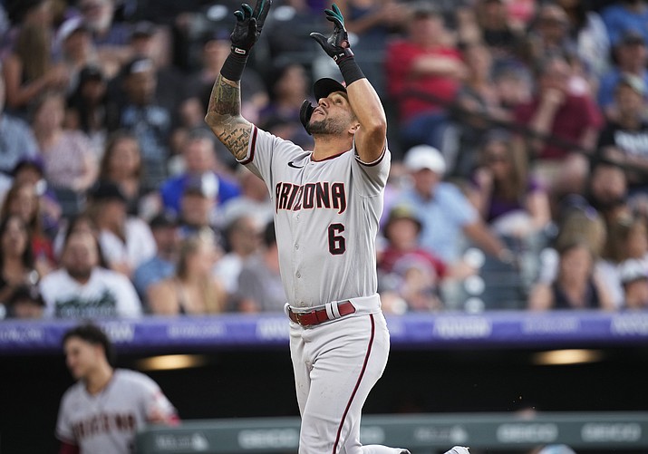 Arizona Diamondbacks’ David Peralta gestures as he crosses home plate after hitting a solo home run off Colorado Rockies relief pitcher Ty Blach during the sixth inning of a game Friday, July 1, 2022, in Denver. (David Zalubowski/AP)