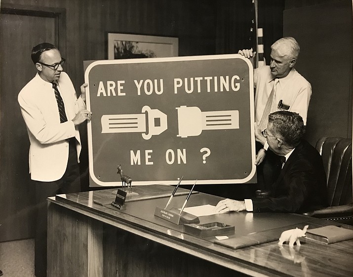 A historic ADOT photo shows new signage encouraging seatbelt safety. According to the National Highway Traffic Safety Administration, 47 percent of passenger vehicle occupants killed in motor vehicle crashes were not wearing a restraint. (Photo/ADOT)