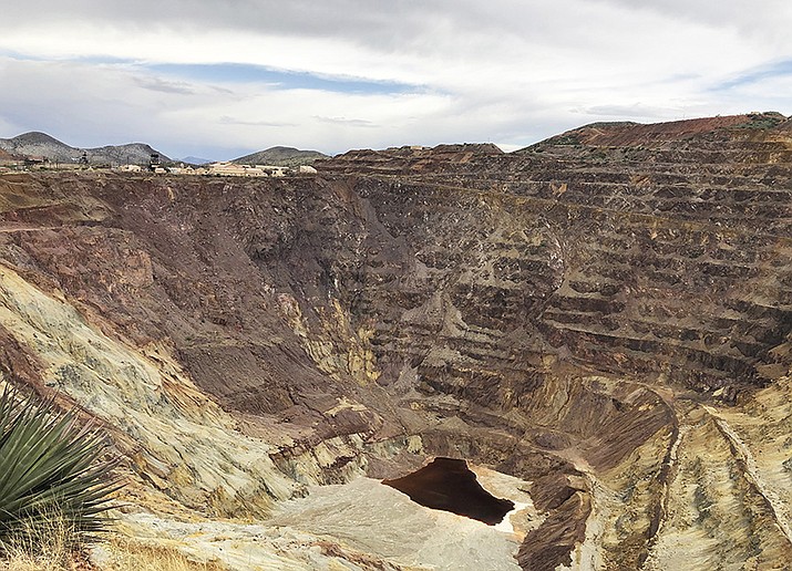 A May 12, 2019 photo, shows what's left of the Lavender pit mine outside Bisbee, Arizona, where the copper operation stopped in 1974. Forty-five years later, the pit remains a scar on the landscape, the layering made from potentially toxic mine tailings. A federal appeals court said the planned mine at Oak Flat does not interfere with Native American tribes ability to practice their religion. (AP Photo/Anita Snow)