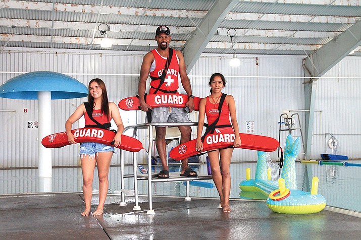 Because of a shortage of lifeguards, Seligman lifeguards Collin Burrelland (center) and Ines Siyuja (right) join  Williams lifeguard Angie Kruse for a shift at the Williams Aquatic Center. Not pictured: Williams lifeguards Cody Payne and Tristen McCarthy. (Loretta McKenney/WGCN)