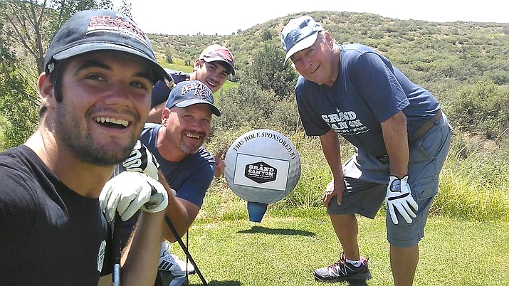 The Adkinson family makes their mark in last year’s Putts & Pints golf tournament. (Photo/Grand Canyon Brewery)