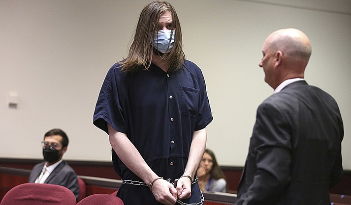 Charlie Malzahn stands during his sentencing hearing in Coconino County Superior Court in Flagstaff on Tuesday, July 12, 2022. The 32-year-old, who brutally killed Arizona elementary school teacher Cathryn Gorospe in 2017 after she bailed him out of jail, will spend the rest of his life prison, a judge said Tuesday. (Jake Bacon/Arizona Daily Sun via AP)