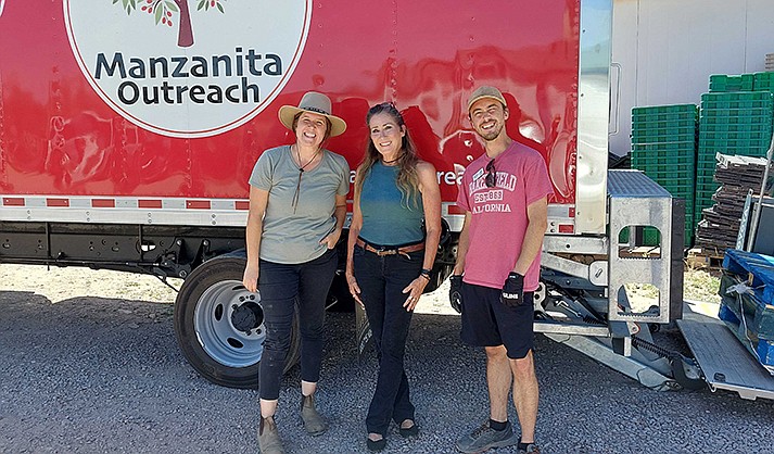 From left, Rebecca Serratos of Prescott Farmer’s Market, Melissa Monahan of Supernatural Sprouts, and Michael Grover of Manzanita Outreach gather to load locally grown produce into the Manzanita Outreach truck at Whipstone Farm in Paulden on June 8, 2022. (Submitted photo)