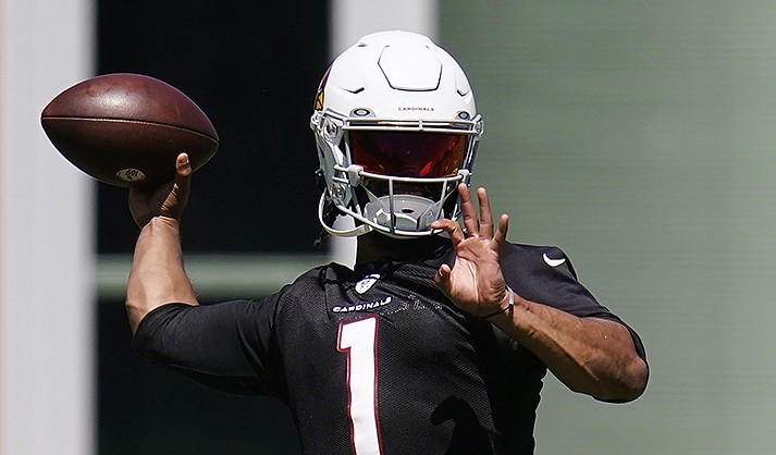 Arizona Cardinals quarterback Kyler Murray throws a pass as he takes part in drills at the NFL football team's practice facility Tuesday, June 14, 2022, in Tempe, Ariz. T(AP Photo/Ross D. Franklin, File)