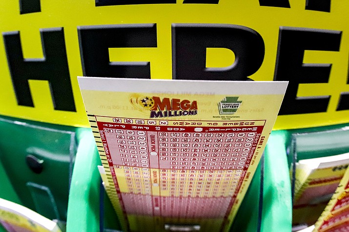 A Mega Millions play-slip for those players preferring to choose the numbers they want to play is among the stacks of other lottery game play-slips displayed in Cranberry Township, Pa., Friday, Jan. 22, 2021. Lottery officials have raised the Mega Millions grand prize to $660 million Thursday, July 21, 2022, giving players a shot at the nation's ninth largest jackpot. (Keith Srakocic/AP, File)