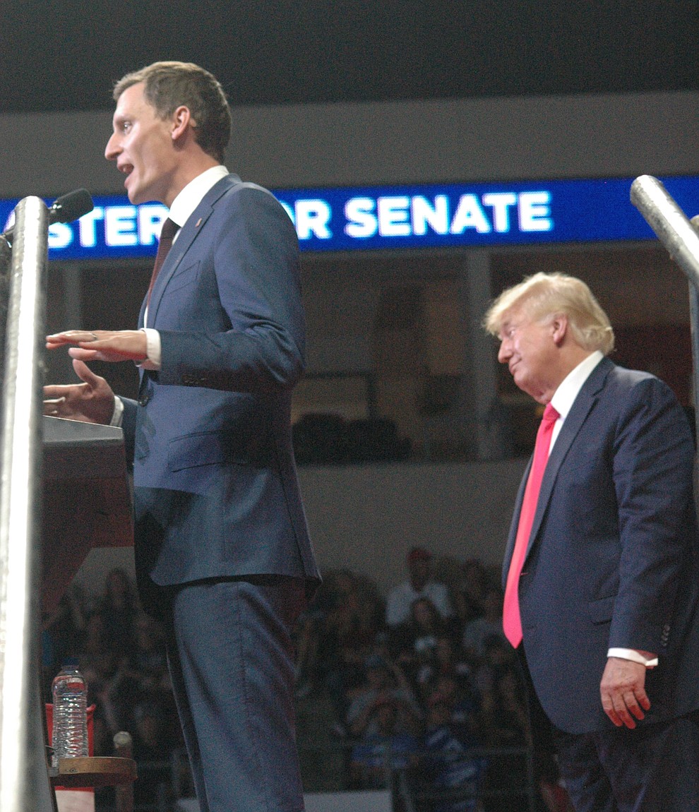 Blake Masters, flanked by Donald Trump, speaks to the "Save America" rally at the Findlay Toyota Center in Prescott Valley Friday evening, July 22, 2022. (Tim Wiederaenders/Daily Courier)