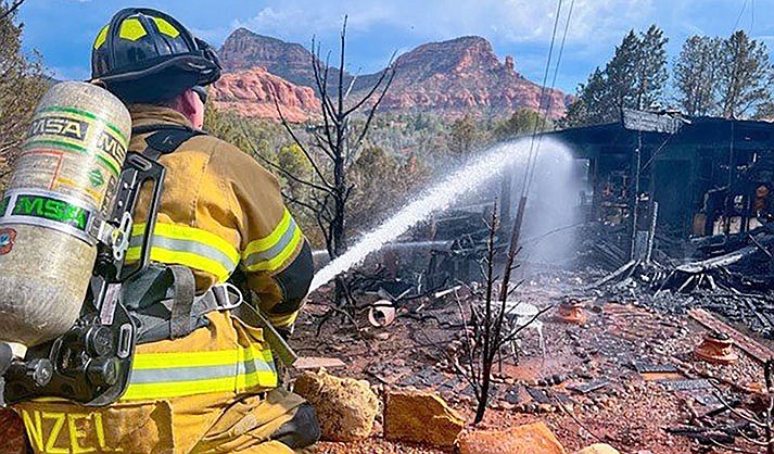 The Sedona Fire Department responded to a house fire Wednesday near Canyon Drive and State Route 179. Although the structure originally involved was lost, crews were able to limit the extension into the wildland interface and save multiple other houses in the immediate area. (Courtesy of the SFD.)