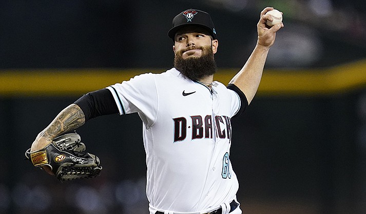 Arizona Diamondbacks starting pitcher Dallas Keuchel throws to a Colorado Rockies batter during the first inning of a baseball game Thursday, July 7, 2022, in Phoenix. (AP Photo/Ross D. Franklin)