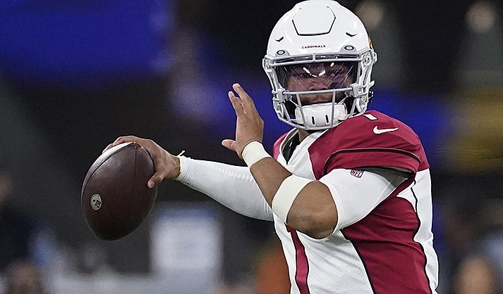 Arizona Cardinals quarterback Kyler Murray (1) passes against the Los Angeles Rams during the second half of an NFL wild-card playoff football game in Inglewood, Calif., Monday, Jan. 17, 2022. Kyler Murray has agreed to a long-term contract that will keep the quarterback with the Arizona Cardinals through the 2028 season. (AP Photo/Marcio Jose Sanchez, File)