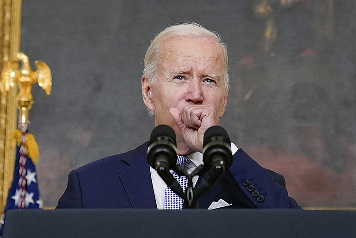 President Joe Biden coughs as he speaks about "The Inflation Reduction Act of 2022" in the State Dining Room of the White House in Washington, Thursday, July 28, 2022. Biden tested positive for COVID-19 again Saturday, July 30, slightly more than three days after he was cleared to exit coronavirus isolation, the White House said, in a rare case of “rebound” following treatment with an anti-viral drug. (Susan Walsh/AP, File)