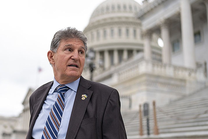 Sen. Joe Manchin, D-W.Va., departs as the Senate breaks for the Memorial Day recess, at the Capitol in Washington, May 26, 2022. A Democratic economic package focused on climate and health care faces hurdles but seems headed toward party-line passage by Congress next month. (J. Scott Applewhite/AP, File)