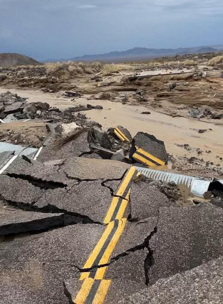 In this photo released by the National Park Service, is the damaged intersection of Kelbacker Road and Mojave Road in the Mojave National Preserve, Calif., Sunday, July 31, 2022. Roads in and out of Death Valley National Park were closed after lanes mud and debris inundated lanes during weekend flash floods in eastern California, western Nevada and northern Arizona. Storm cells dumped localized heavy rain across the region, prompting closures of highways and campgrounds. (National Park Service via AP)
