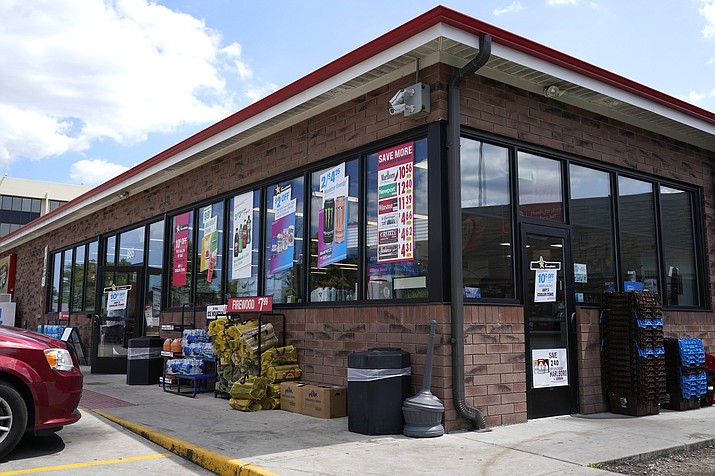 Vehicles are parked outside the Illinois Speedway gas station in Des Plaines, Ill., where the winning Mega Millions lottery ticket was sold, Saturday, July 30, 2022. A ticket-holder in the state clinched the $1.337 billion Mega Millions jackpot from the ticket was sold there. (Nam Y. Huh/AP)