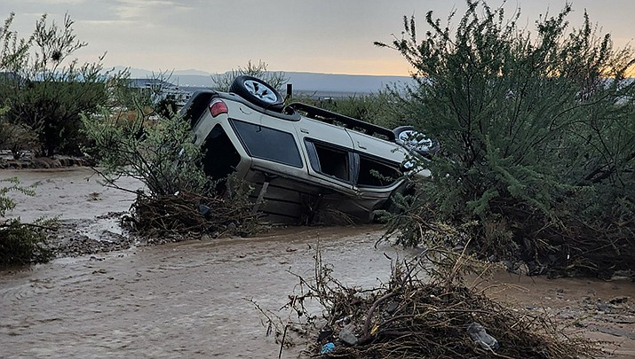 An overturned SUV is pictured during flooding near the intersection of Chino Road and Bosque Road in Golden Valley on Sunday, July 31. (Mohave County Sheriff’s Office Search and Rescue photo)
