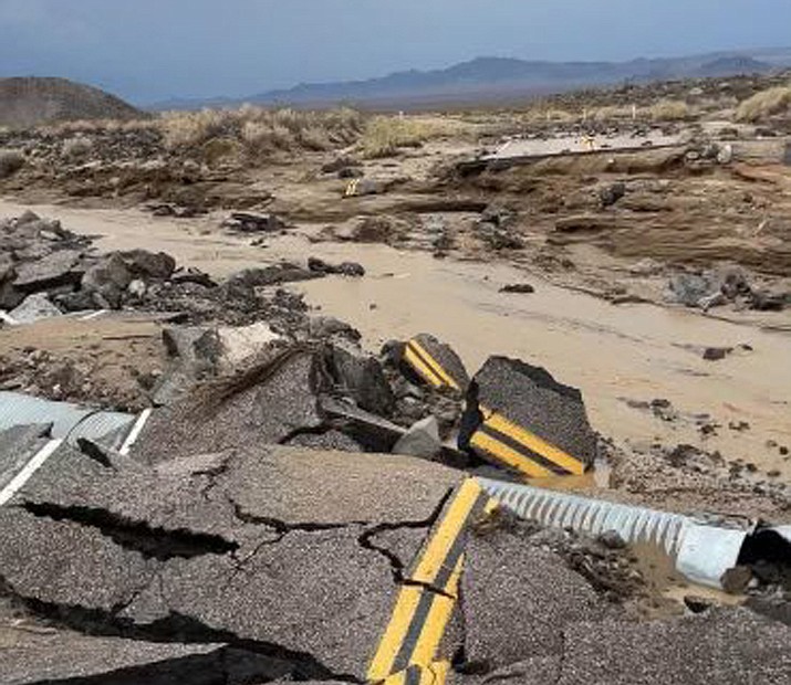 The intersection of Kelbacker Road and Mojave Road in the Mojave National Preserve are damaged from flooding. Roads in and out of Death Valley National Park were closed after lanes mud and debris inundated lanes.  (National Park Service via AP)
