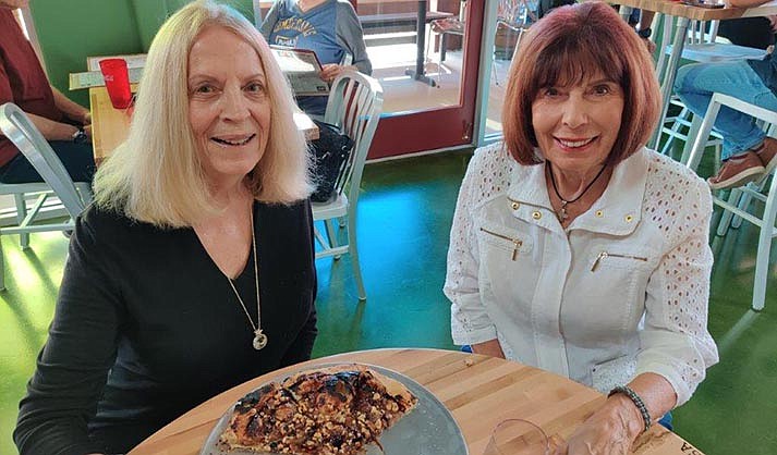Christine Burdette and Barbara Perry enjoying passionista pizza with fig jam.