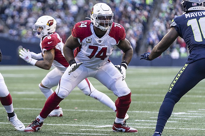 Arizona Cardinals offensive lineman D.J. Humphries looks to block during the team's NFL football game against the Seattle Seahawks Nov. 21, 2021, in Seattle. The Cardinals have signed Humphries to a new contract that will keep him with the team through the 2025 season. (Stephen Brashear, AP File)